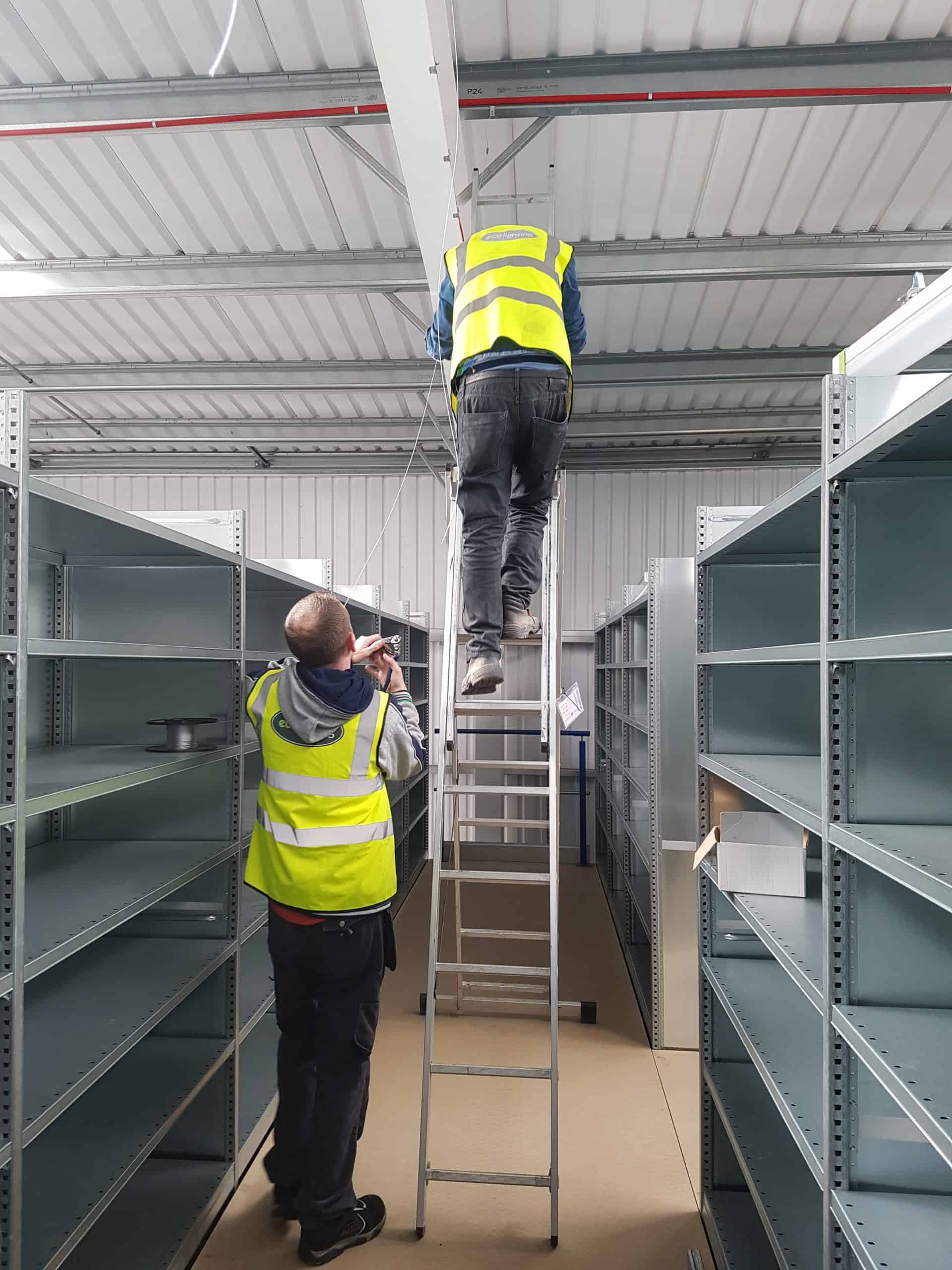 20180503 120410 two men installing led lights
