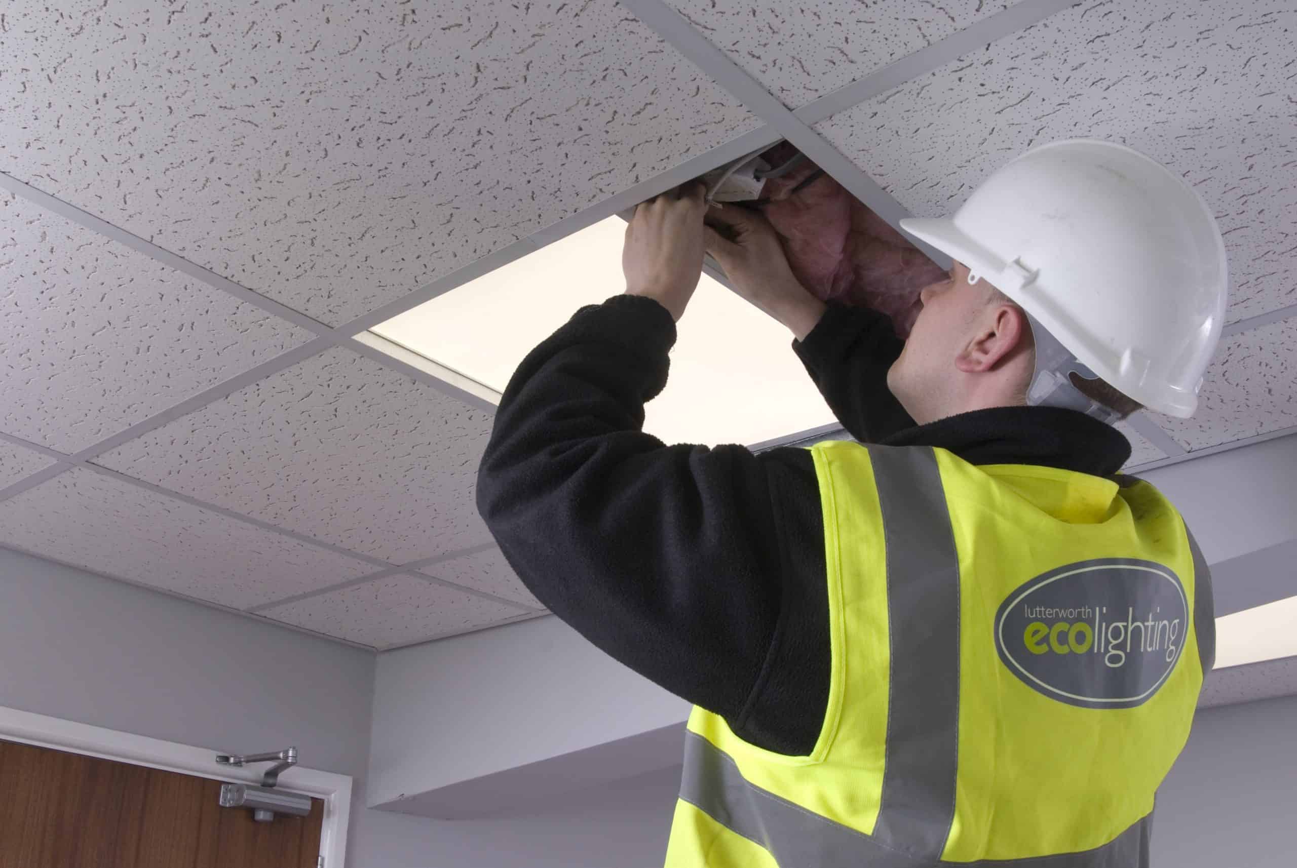 man installing lights
